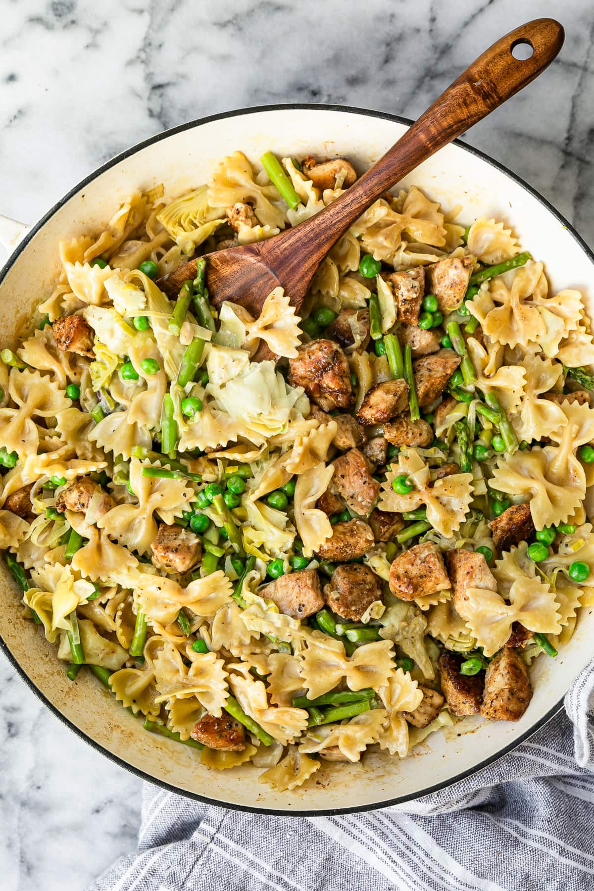 One Pot Chicken Pasta with a wooden spoon